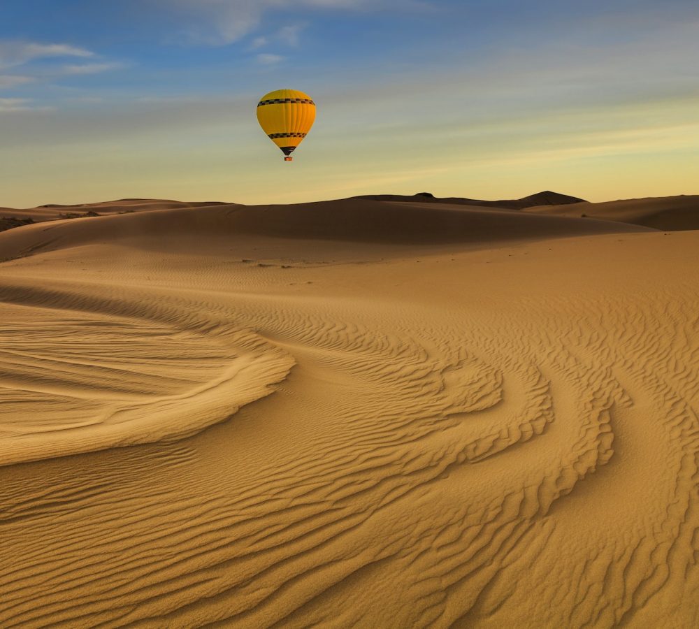 Hot Air Balloon in the desert at sunset background